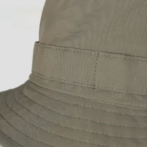 Macro detail of high-quality reinforced stitching on a quick-dry nylon bucket hat brim