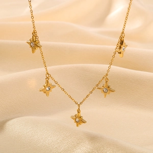 Elegant 18k gold plated star pendant necklace with cubic zirconia on silk fabric
