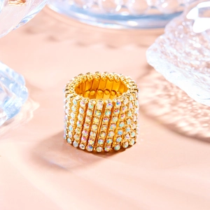 Detailed close-up of a gold-plated multi-row ring featuring iridescent crystal rhinestones