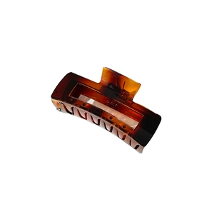 Minimalist amber tortoise shell hair claw clip with rectangular hollow design for women