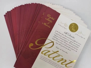 Close-up of official United States patent certificates for the magnetic water balloon toy