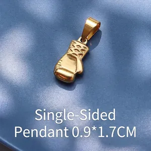Macro detail of 18K gold-plated stainless steel boxing glove pendant 0.9x1.7cm