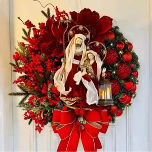 Christmas wreath with LED lantern featuring nativity scene figures and red velvet flowers