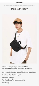 Close-up of black nylon crossbody bag on male model showing multiple zipper compartments