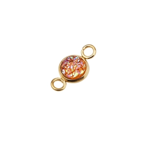 Detail of 6mm vacuum gold-plated stainless steel star pendant with iridescent orange stone