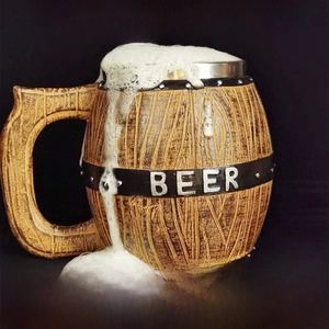 Detail of wooden barrel style beer mug featuring rustic texture and stainless steel liner