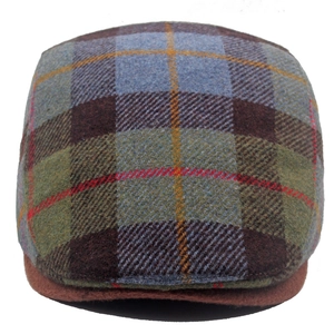 Detail shot of the blue and brown plaid wool blend texture on a classic newsboy cap