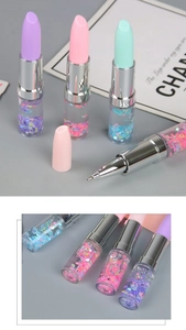 Macro detail of lipstick-shaped liquid glitter pens with colorful flowing sequins and stars