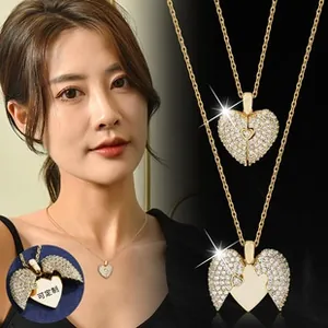 Detail of heart clover necklace with crystals showing the open and closed folding structure