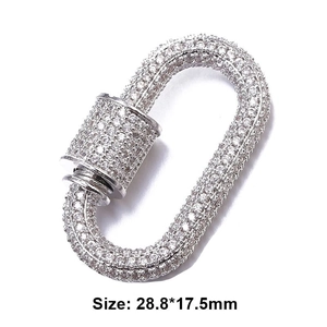Macro detail of silver oval screw clasp with pavé clear stones sized 28.8x17.5mm