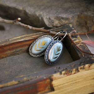 Blue enamel floral earrings with gold trim and oval geometric hooks in vintage style
