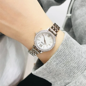 Elegant silver stainless steel ladies watch with crystal bezel and white dial on wrist