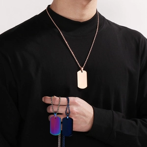 Polished stainless steel dog tag necklaces in rose gold, rainbow, and navy blue