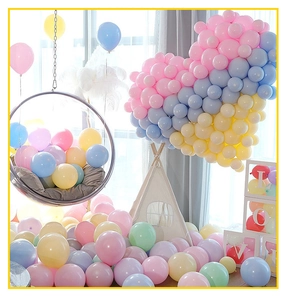 Detail of pastel macaron balloon set with heart-shaped wall and LOVE transparent boxes