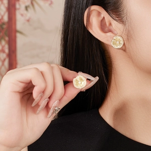 Elegant gold lotus leaf earrings in S925 silver with central crystal and halo stones