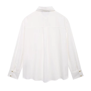 Rear view of white crepe long sleeve shirt showing back yoke and golden buttons on cuffs
