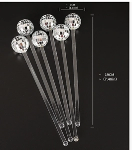 Macro shot of 19cm disco ball cocktail stirrers with 3cm silver mirrored glass ball