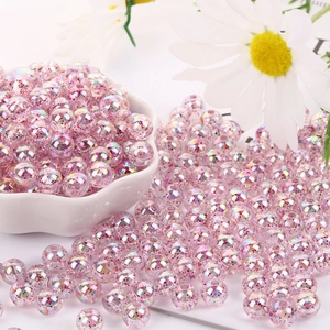 Macro shot of 8mm pink AB acrylic beads with glitter for DIY handmade bracelets