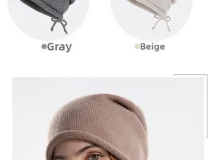 Detail view of slouchy knit beanie featuring side drawstring and rolled hem in soft fabric