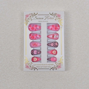 Macro shot of 24pcs Valentine's Day press-on nails with red lip prints and cherry patterns