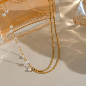 Elegant gold-plated double-layer necklace featuring delicate white pearl beads for women