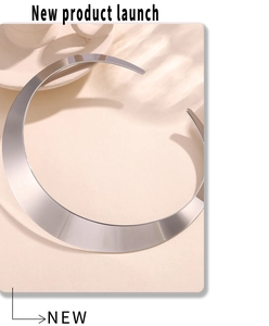 Close-up of polished silver wide collar necklace with minimalist industrial design