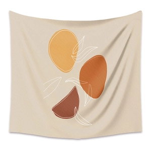 Detailed close-up of bohemian wall tapestry with abstract geometric shapes and leaf art