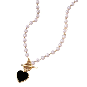 Chic pearl necklace with black heart pendant and gold toggle clasp on white background