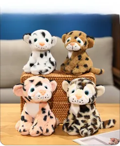 Detailed close-up of four plush leopard dolls in various colors inside a woven basket