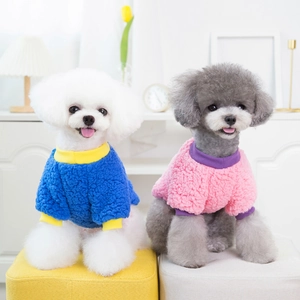 Detail of warm sherpa fleece pet sweaters with contrast colors and ribbed cuffs