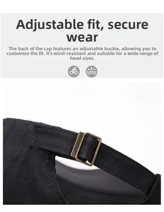 Close-up of adjustable bronze metal buckle and fabric texture on a black men's cap