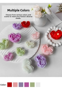 Detailed close-up of heart-shaped rose scented candles in various pastel colors