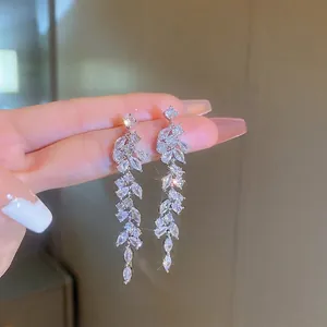 Silver leaf tassel earrings featuring marquise cubic zirconia in a long dangle design