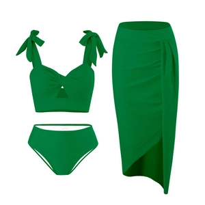 Three-piece green bikini set featuring bow shoulders and wrap skirt on a white background
