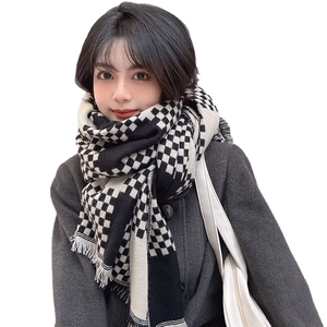 Classic black and white checkered knit scarf with fringe tassels for winter wear