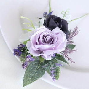 Elegant purple artificial rose boutonniere with green leaves for wedding ceremonies