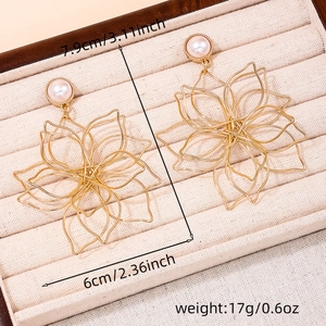Detailed dimensions of gold woven flower earrings with pearl accents and sizing info