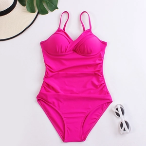 Detailed view of rose pink one-piece swimsuit with ruched waist and pleated bust detail