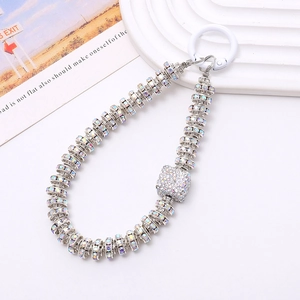 Detailed macro view of the sparkling silver rhinestone phone strap with AB crystals