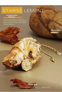 Detailed macro of gold vintage necklace with starburst pendant on rustic stone