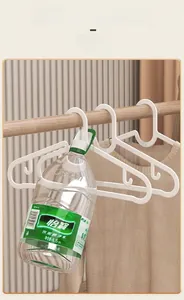 Close-up showing the strong weight-bearing capacity of this white non-slip plastic clothes hanger