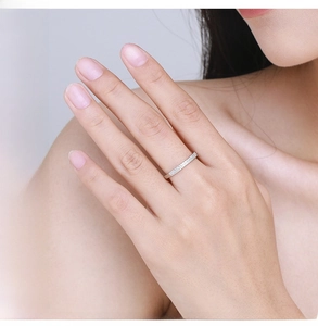 Detail of S925 sterling silver double row pavé ring worn on a finger