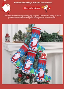 Detailed view of blue felt Christmas stocking with Santa Claus and snowflake applique