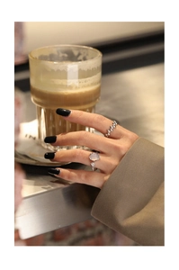 Detailed view of S925 silver ring set with agate gemstone and floral vine engraving