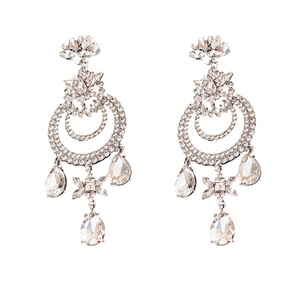 Vintage silver crystal earrings with floral design and teardrop pendants on white background