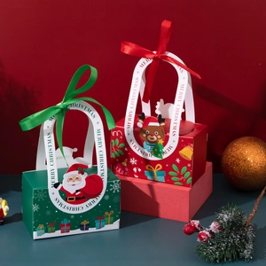 Christmas paper gift boxes with Santa and Reindeer designs and decorative ribbons