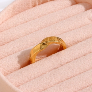 18K gold plated stainless steel ring with a geometric wave texture in a pink velvet box