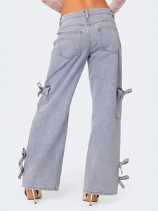 Women's light blue wide leg cargo jeans with bow tie side pockets and high waist fit
