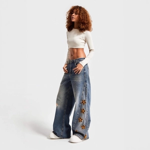 Women's high waist wide leg blue jeans featuring elegant yellow floral embroidery
