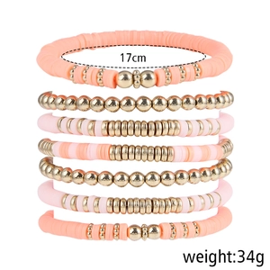 7-piece Bohemian stackable bracelet set with pink polymer clay beads and gold accents